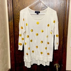 This is a Charlie Paige sweater. It is white with gold polka dots. Size S/M.
